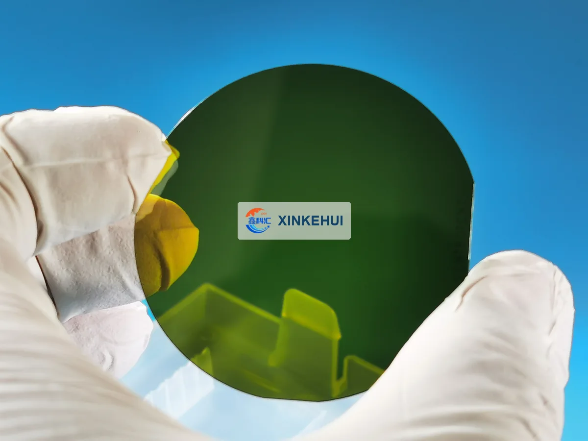 Backlit silicon carbide wafer sample; appearance varies with illumination